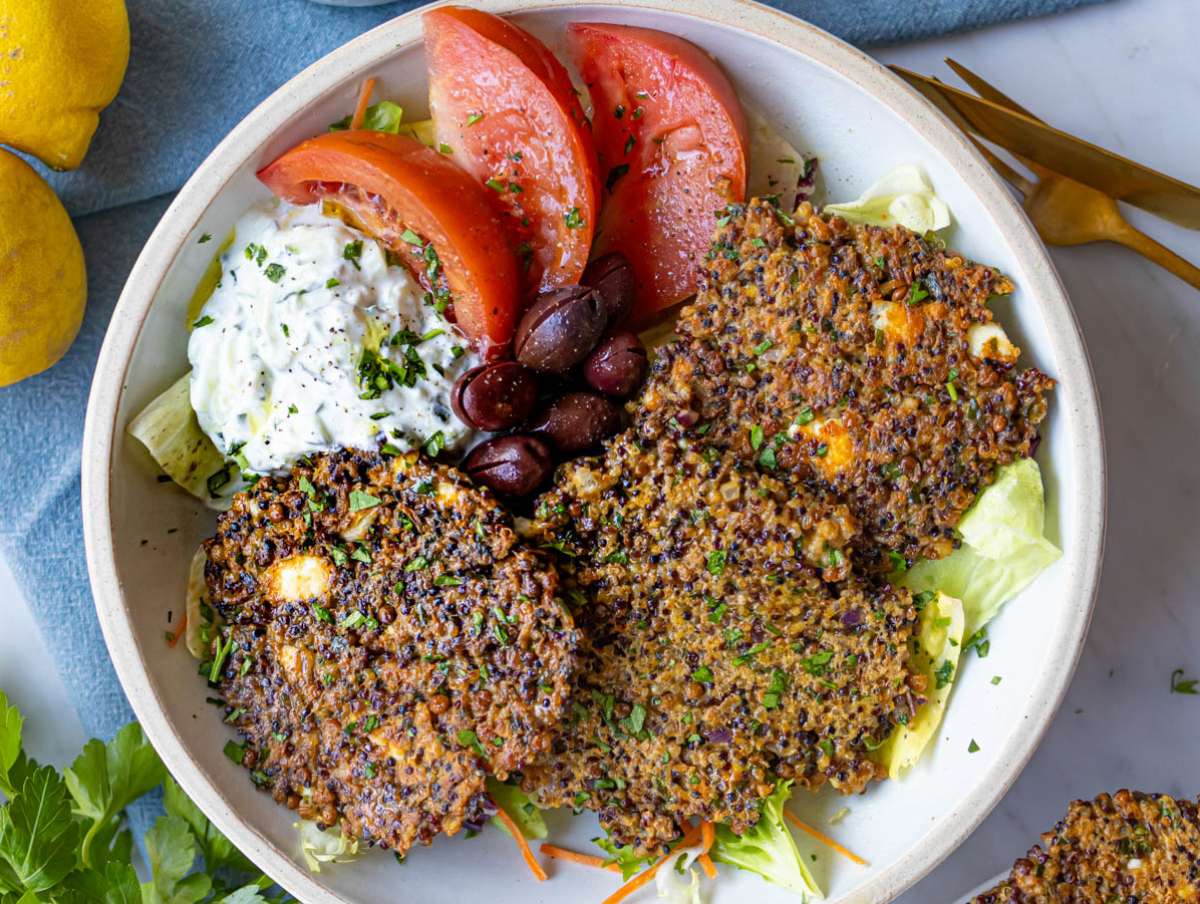 Step 4 Cooked patties served in a bowl with tzatziki olives and tomatoes.