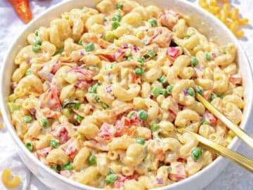 Step 4 Mixing pasta vegetables and dressing for creamy pasta salad without mayo overload.