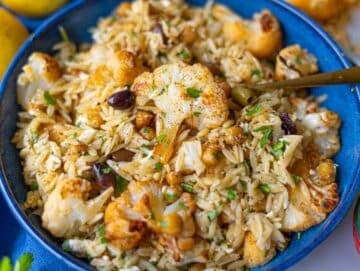 Step 4 Roasted cauliflower orzo with chickpeas and feta served in a bowl.