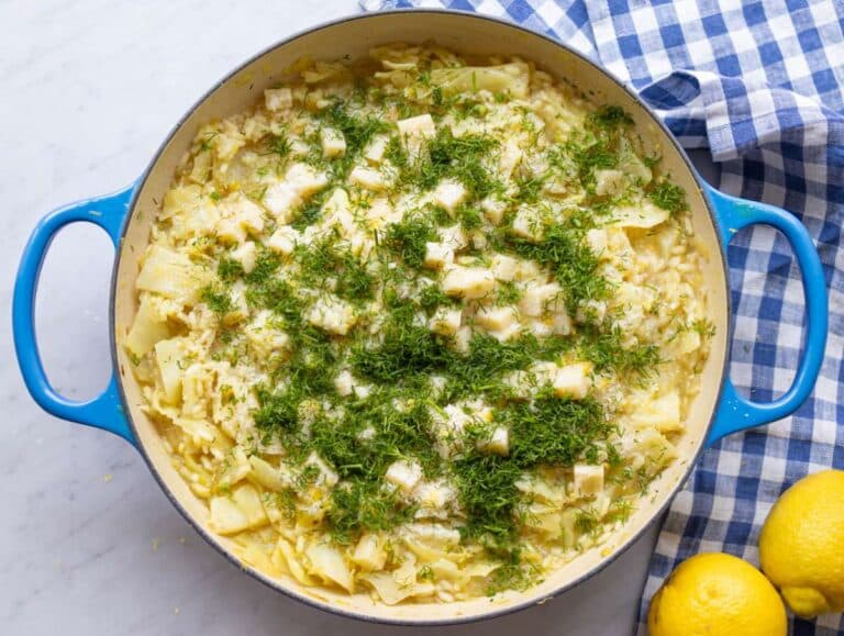 Step 4 Stirring diced Swiss cheese and parmesan cheese into the cooked rice until melted and stringy.