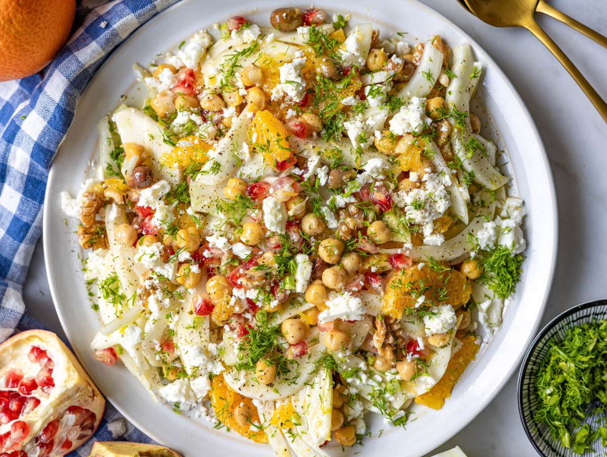 Step 5 Tossing orange fennel salad with chickpeas dressing and serving with feta.