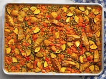 Step three Vegetable Paella baking in oven until rice is tender and edges caramelized.