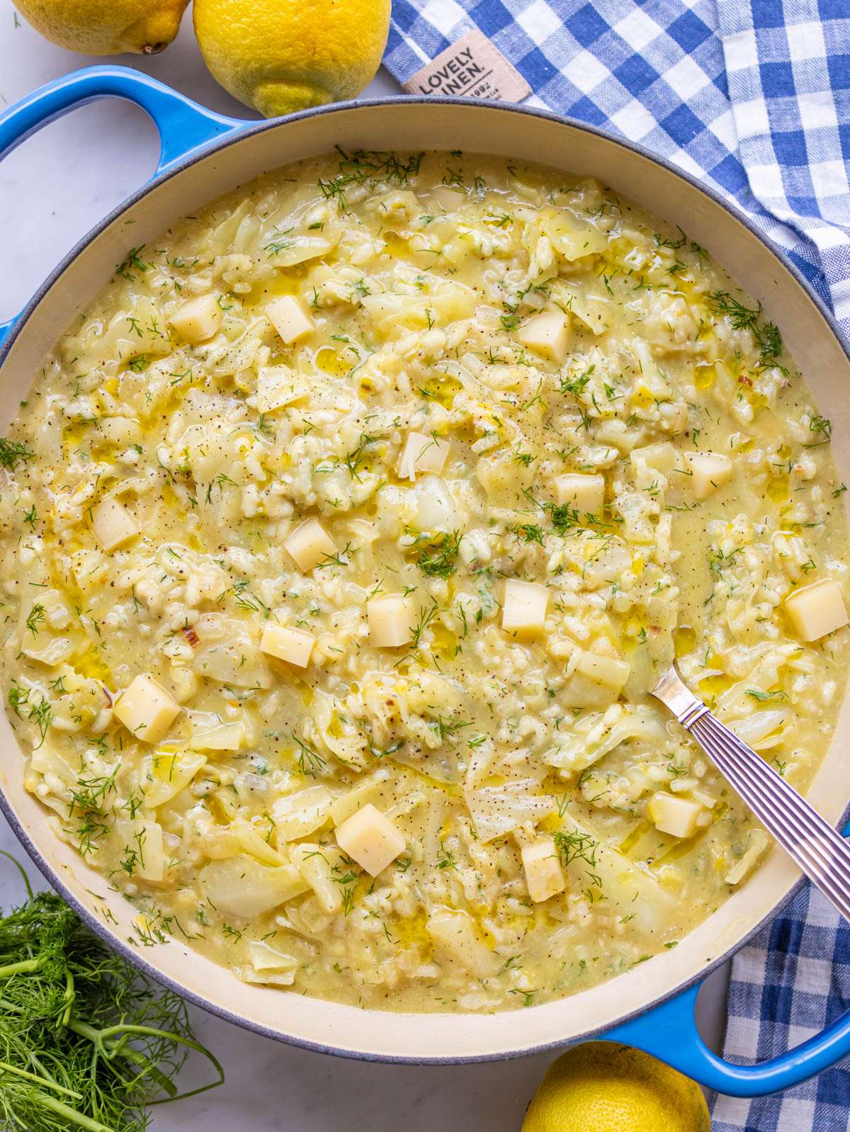 Top down view of a skillet filled with nutritious Lahanorizo and a spoon.