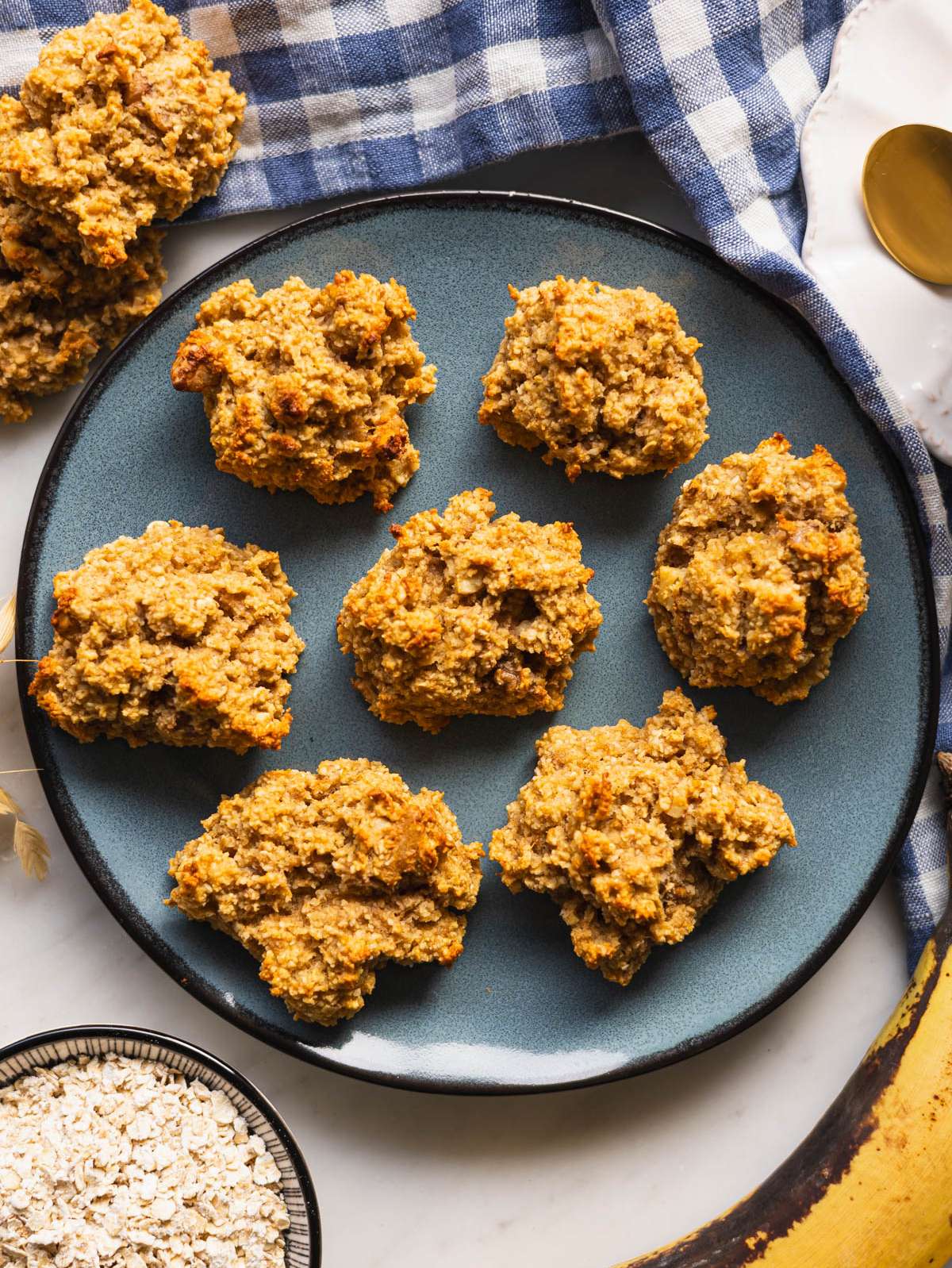 Top down view of healthy banana cookies on a blue plate ready to serve