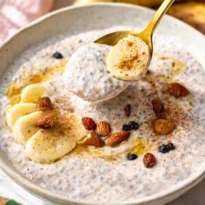 Banana chia pudding served simply in a bowl with spoon, soft natural light.