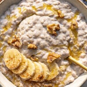 Banana overnight oats served simply in a bowl with spoon and soft morning light.