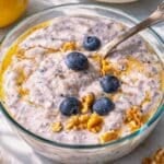 Bright bowl of blueberry overnight oats on a sunlit table with Mediterranean kitchen feel.
