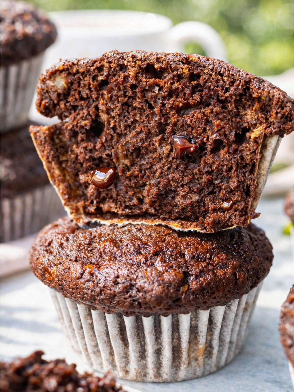 Close-up of a banana chocolate muffin showing tender crumb and melted chocolate pockets.