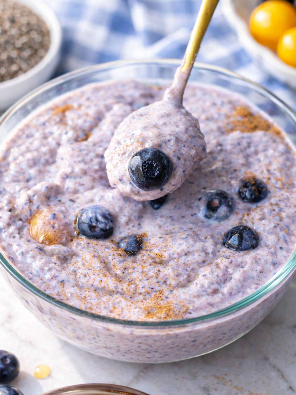 Close up of blueberry chia pudding showing thick creamy texture with blended berries.