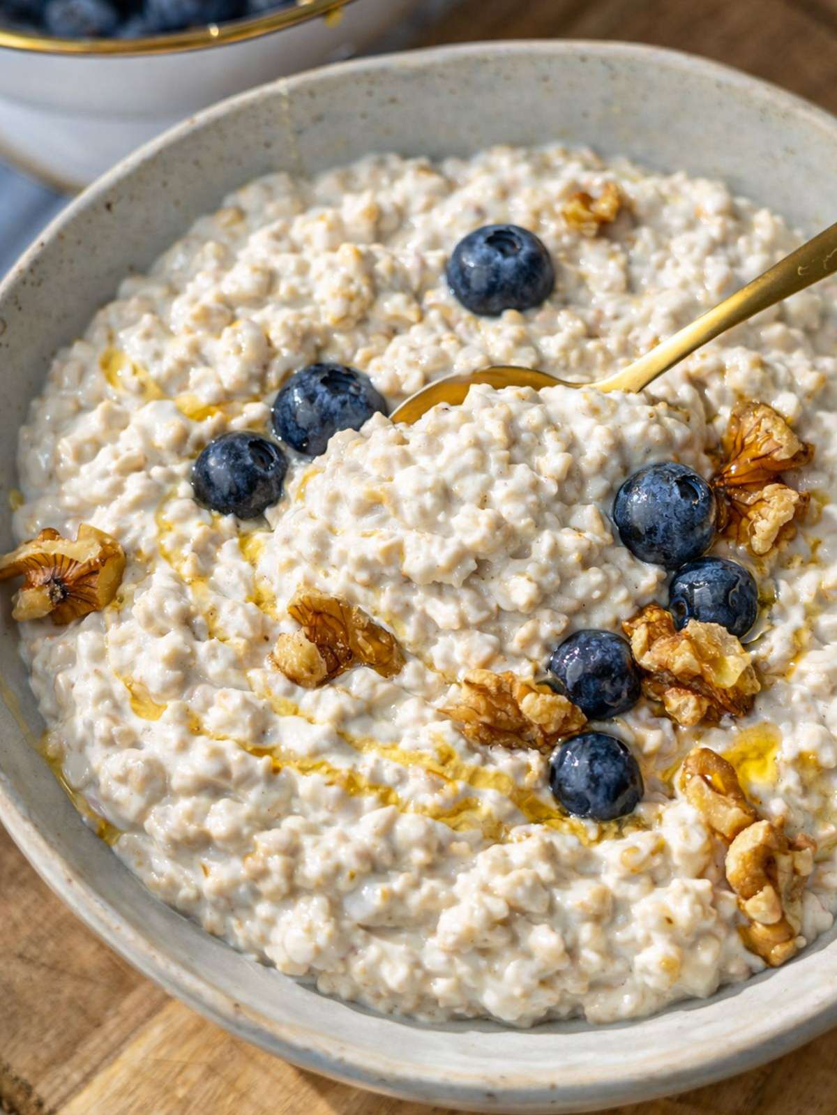 Close-up of creamy oats showing thick texture with yogurt and oats fully softened.