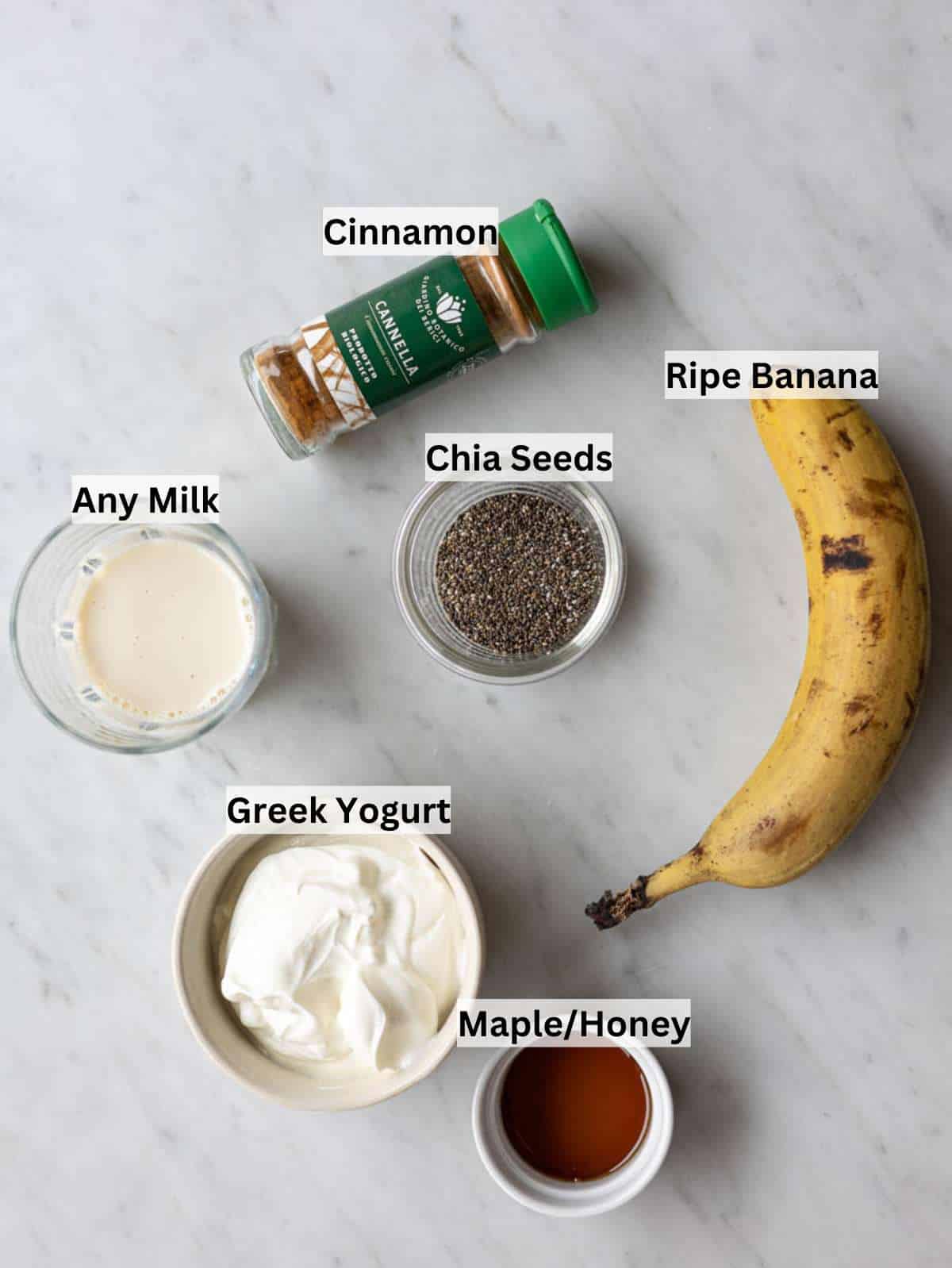 Ingredients for banana chia pudding with Greek yogurt, ripe banana, chia seeds, milk, honey, cinnamon.
