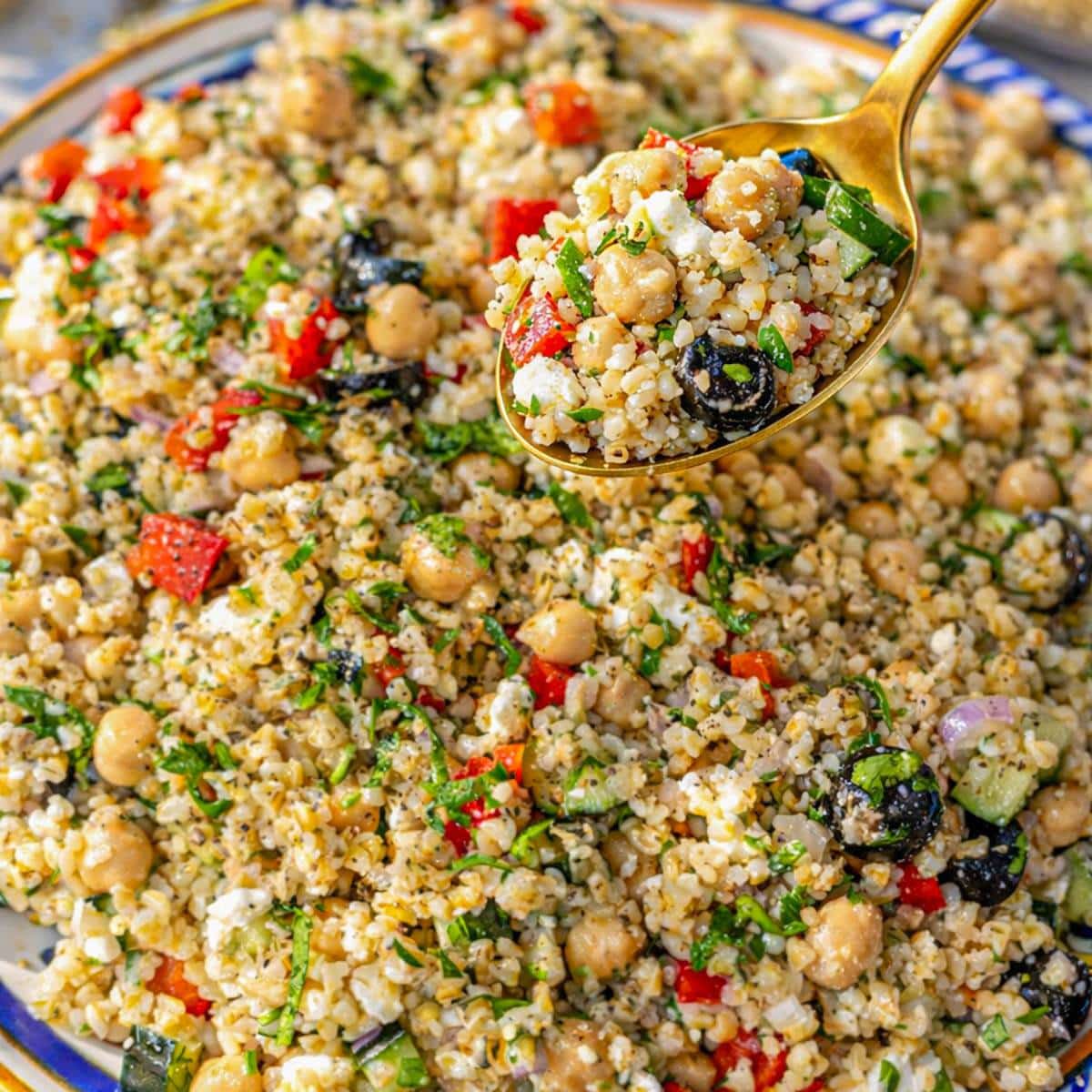 Platter of bulgur salad served family style with spoon