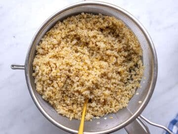Step 1 Boiled bulgur draining over a pot.