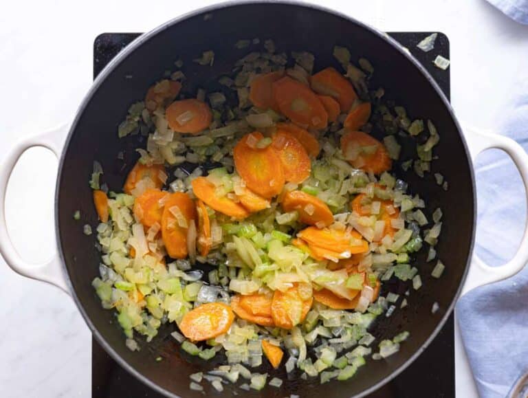 Step 1 Chopped onion carrots and celery cooking gently in olive oil.