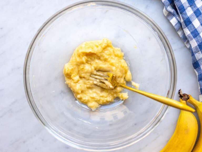 Step 1 Ripe banana mashed in a bowl with a fork until mostly smooth.