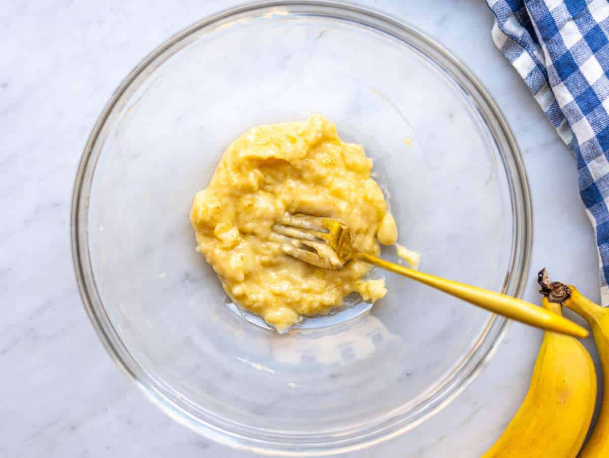 Step 1 Ripe banana mashed in a bowl with a fork until mostly smooth.