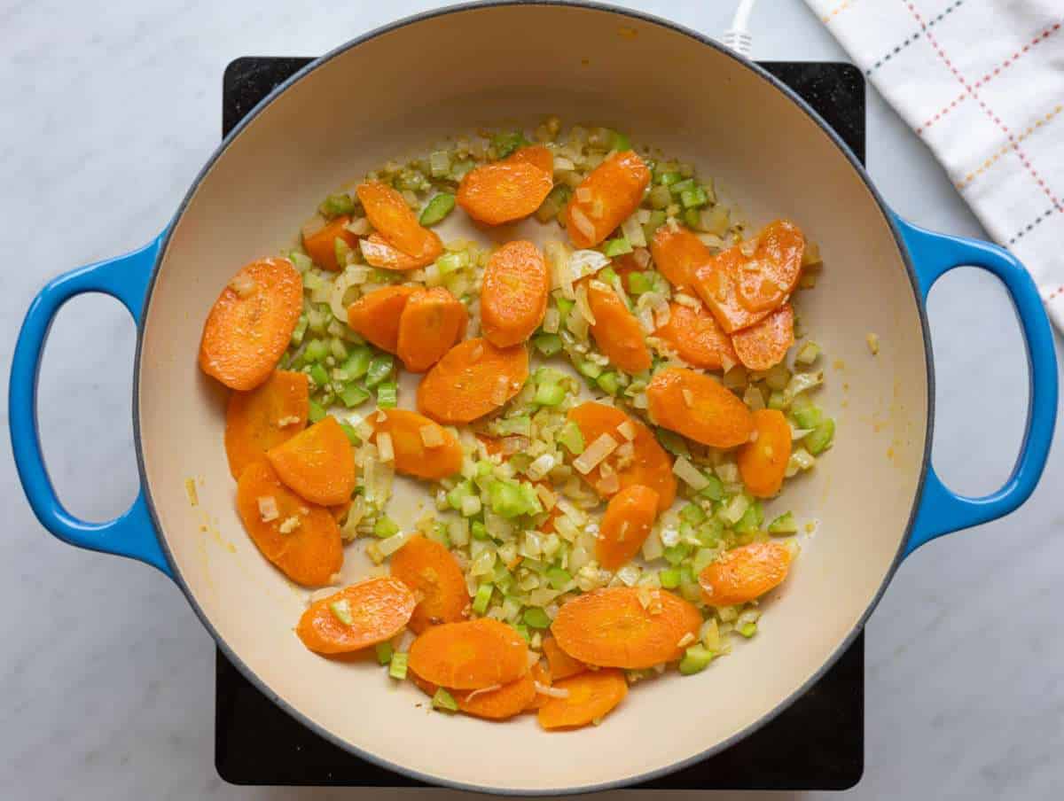 Step 1 Steaming pot with onion, carrot, and celery softening gently in olive oil.