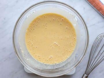 Step 2 Applesauce yogurt egg and honey whisked together in a large bowl.