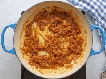 Step 2 Garlic and shawarma spices blooming gently in the skillet with a splash of water.