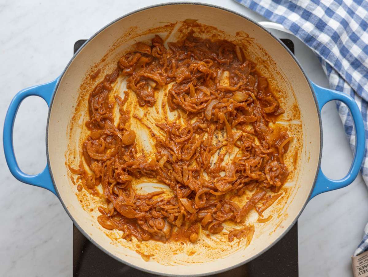 Step 2 Garlic and shawarma spices blooming gently in the skillet with a splash of water.