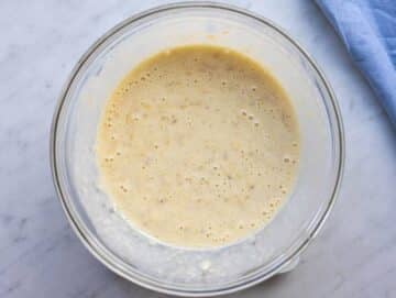 Step 2 Mashed bananas mixed with yogurt egg honey and vanilla in a bowl.