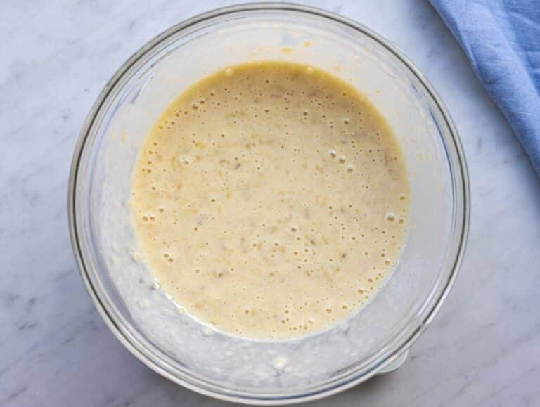 Step 2 Mashed bananas mixed with yogurt egg honey and vanilla in a bowl.