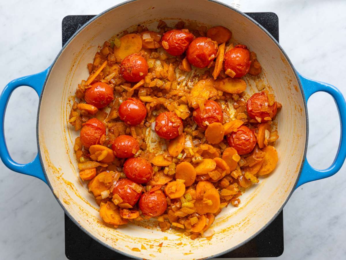 Step 2 Spices and garlic added to the pot with tomatoes and vegetables