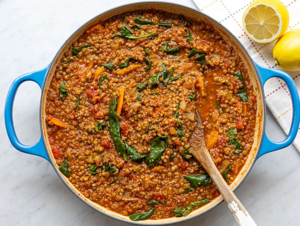 Step 3 Fresh spinach added to the soup, just beginning to wilt into the broth.