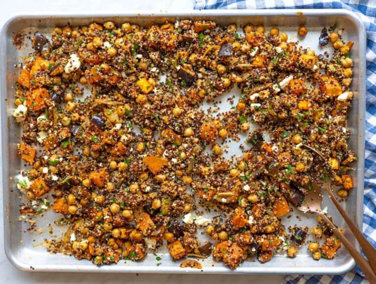 Step 3 Quinoa and feta tossed into the hot sheet pan with roasted vegetables and fresh parsley.