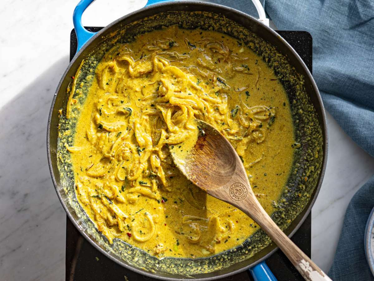 Step 3 Spices and yogurt stirred into onions creating a creamy, fragrant base.