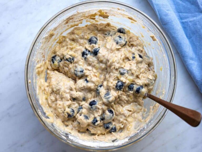 Step 4 Blueberries gently folded into thick muffin batter.
