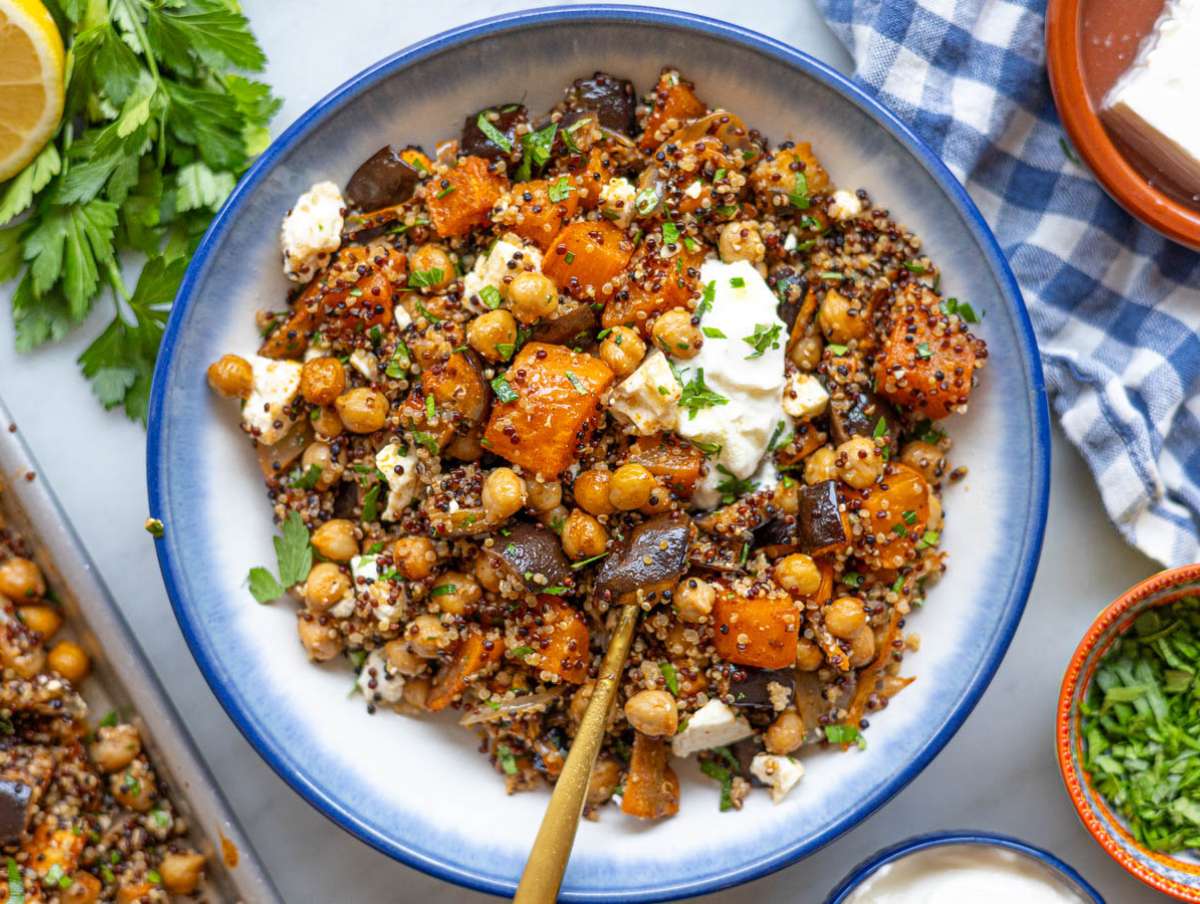 Step 4 Chickpea shawarma bowl with quinoa, vegetables, and yogurt sauce served in a bowl.