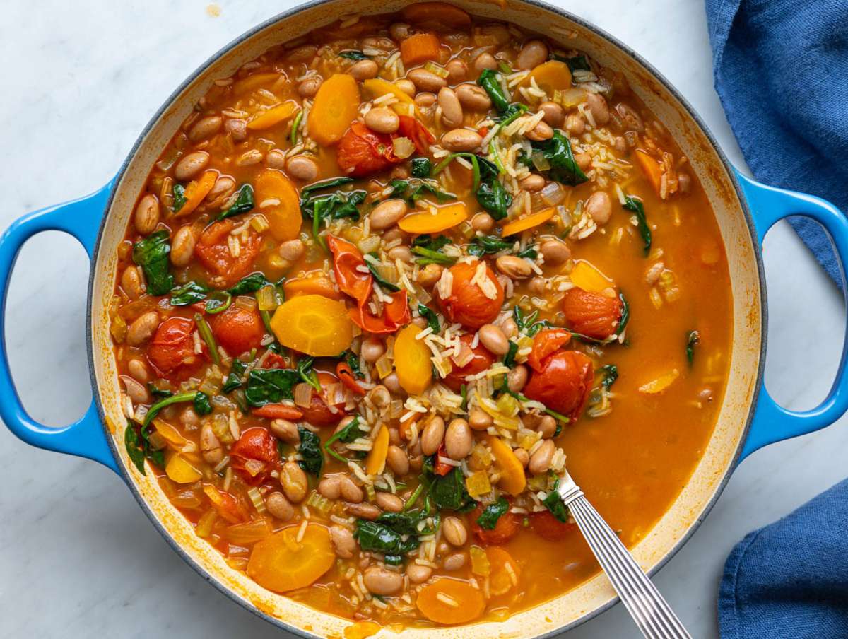 Step 4 Spinach and rice stirred into the soup just before finishing.