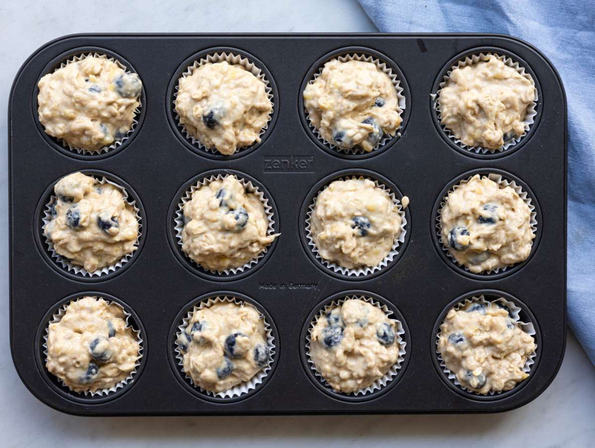 Step 5 Muffin batter scooped into lined muffin pan filled to the top.