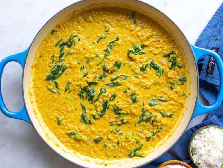 Step 5 Spinach wilting into the dal as cream is stirred in.