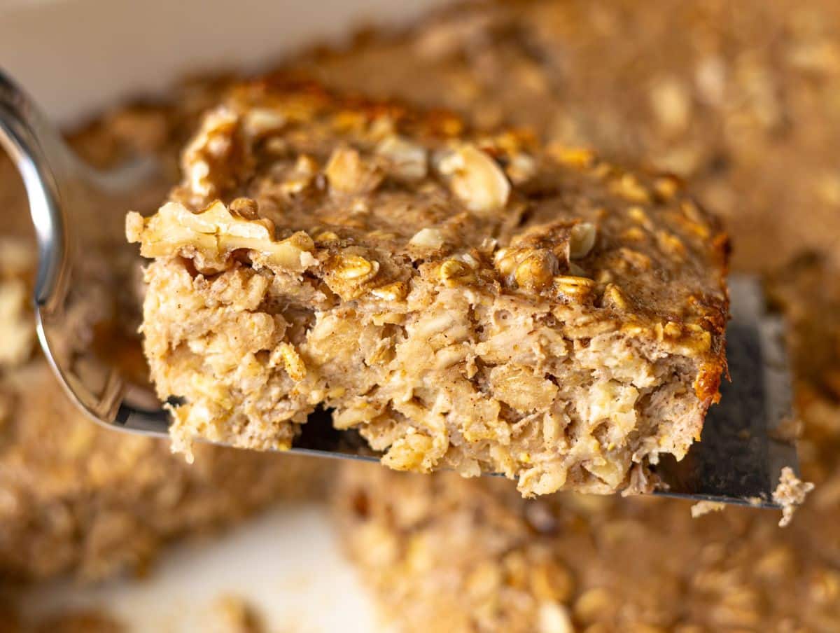 Close-up of banana baked oatmeal slice showing creamy, tender crumb.