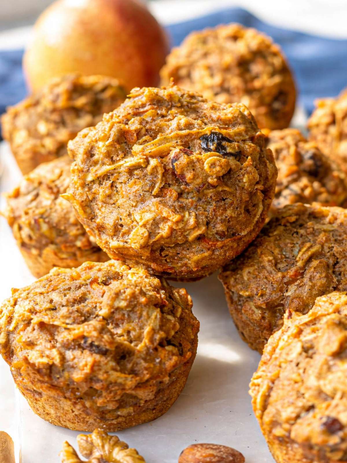 Close up of muffin showing grated carrot, oats, and raisins.