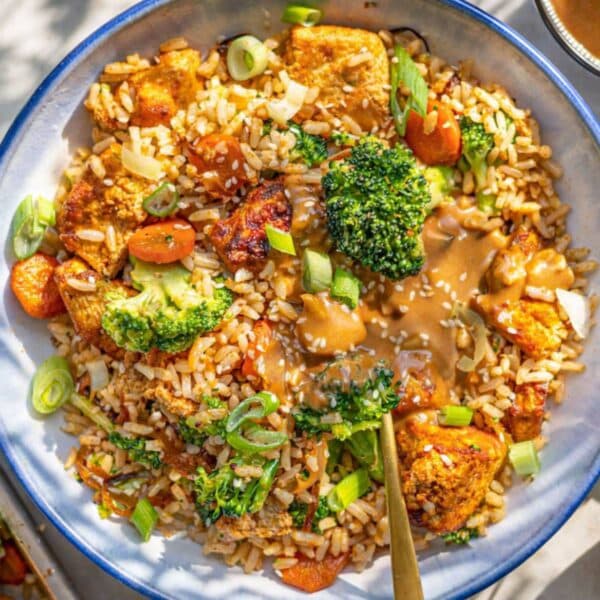Easy Tofu Rice Bowl with Peanut Sauce served in a bowl, colorful, comforting, and filling.
