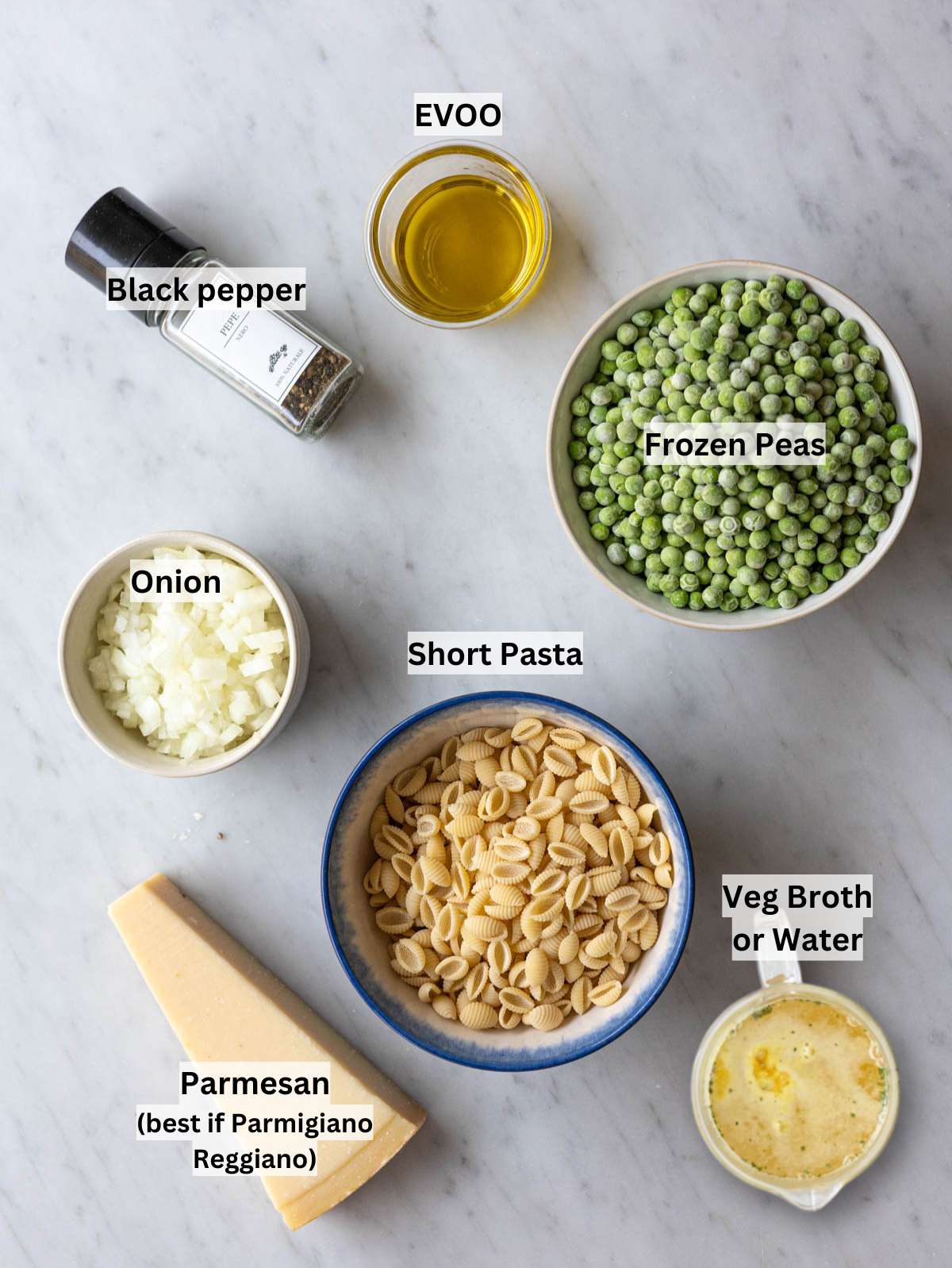Ingredients for pasta and peas with pasta peas onion olive oil vegetable broth and Parmesan.