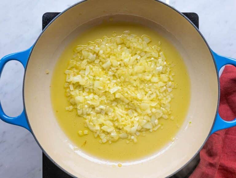Step 1 Chopped onion cooking gently in olive oil in a wide pan.