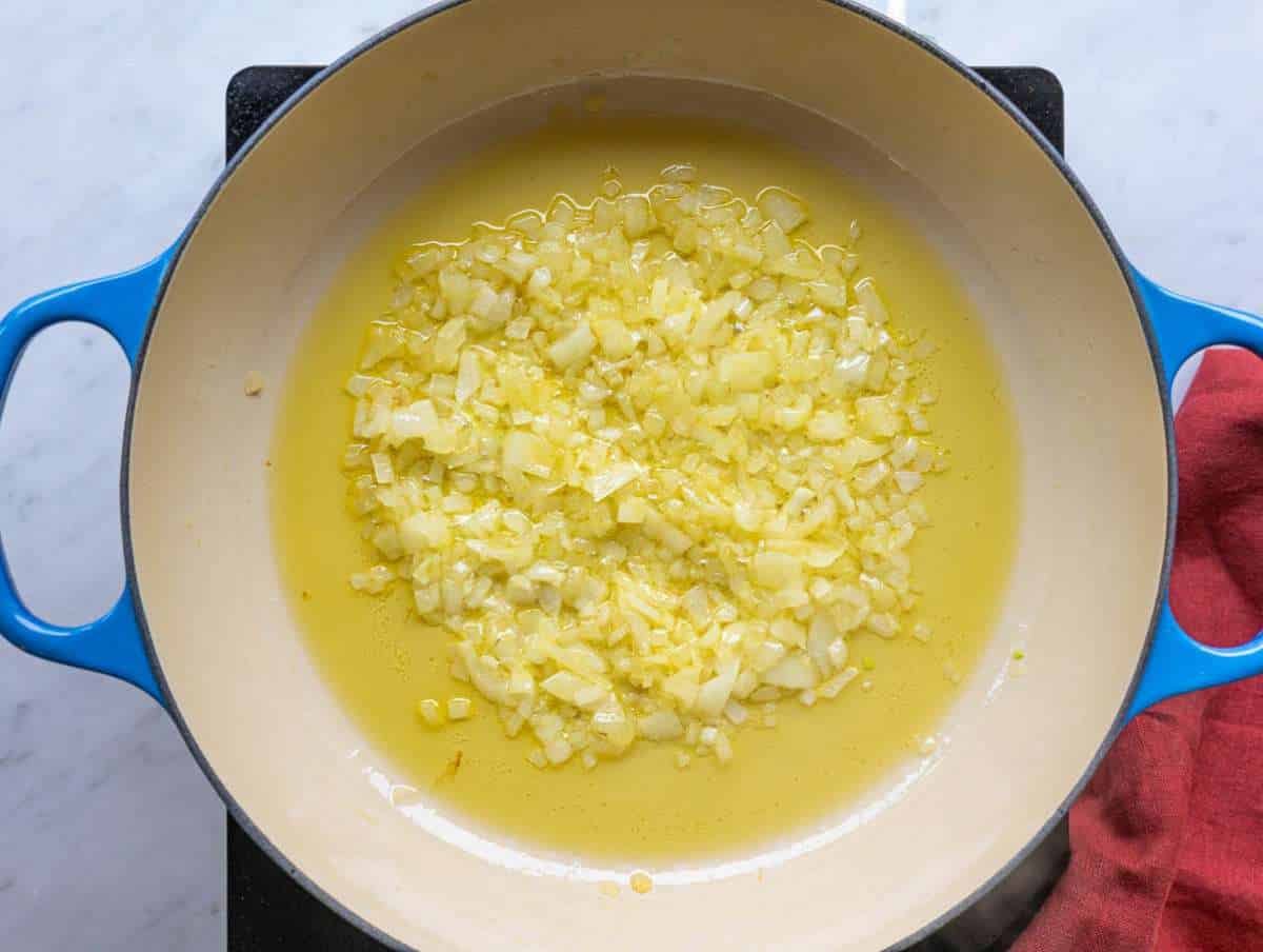 Step 1 Chopped onion cooking gently in olive oil in a wide pan.