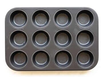 Step 1 Greased 12 cup muffin pan on table