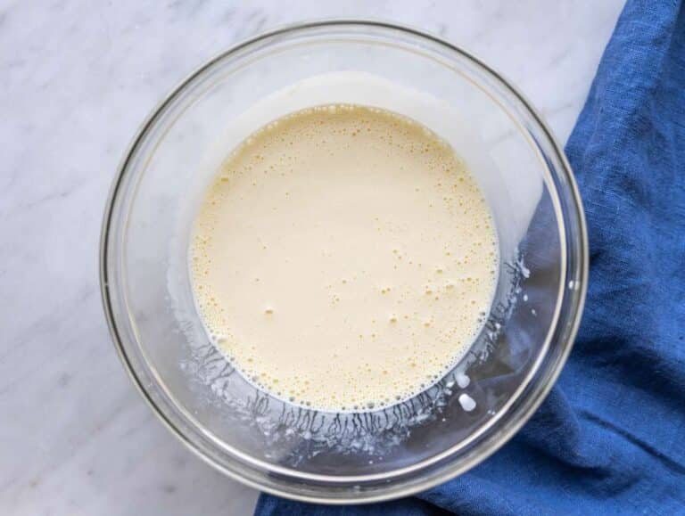 Step 1 Greek yogurt, milk, eggs, and honey whisked together in glass bowl.