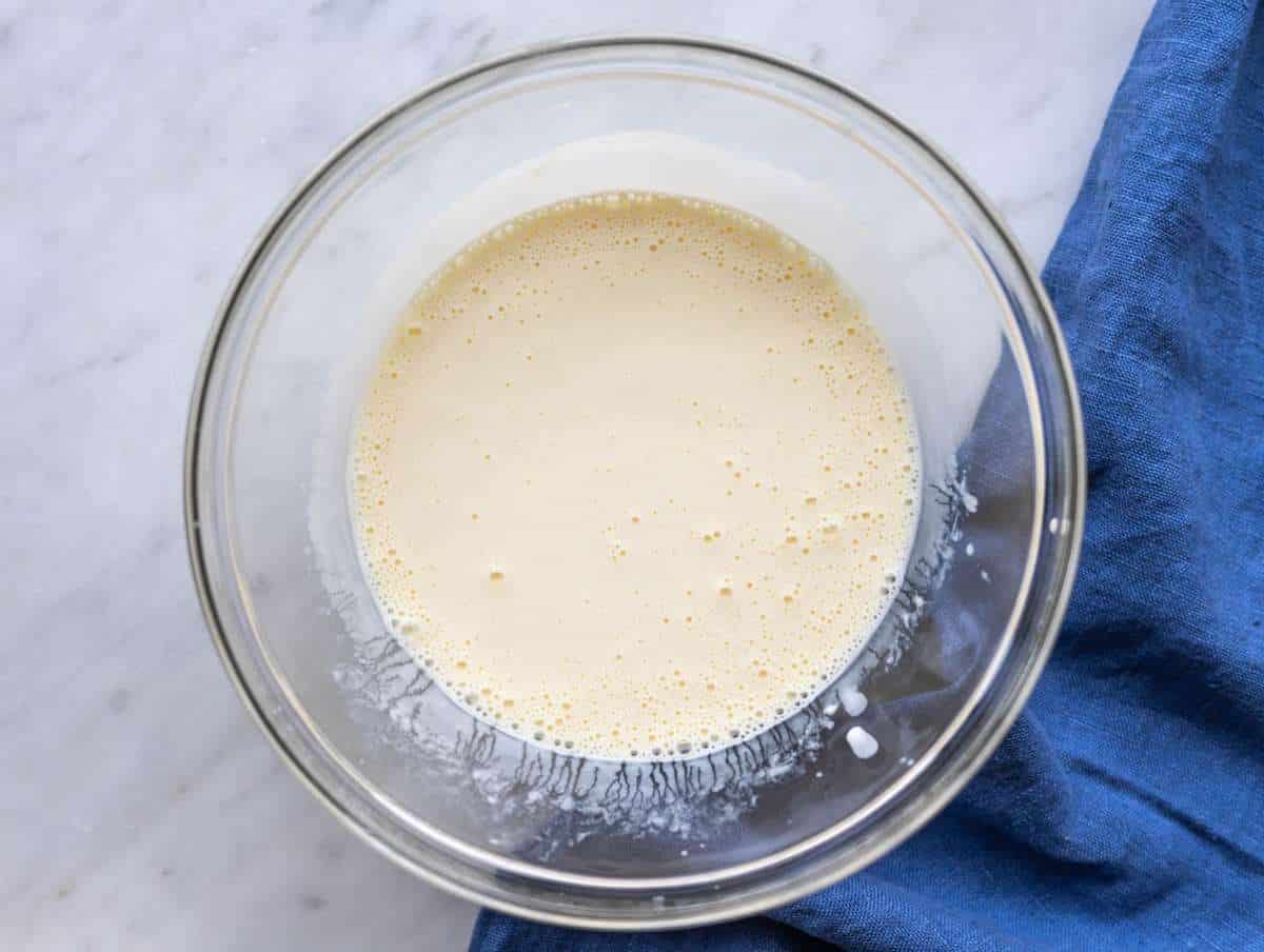 Step 1 Greek yogurt, milk, eggs, and honey whisked together in glass bowl.