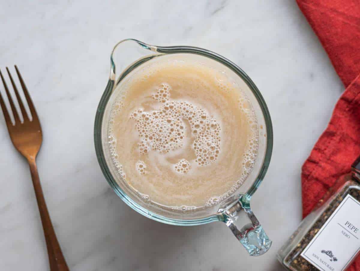 Step 1 Yeast dissolving in lukewarm water and sugar in a small bowl.