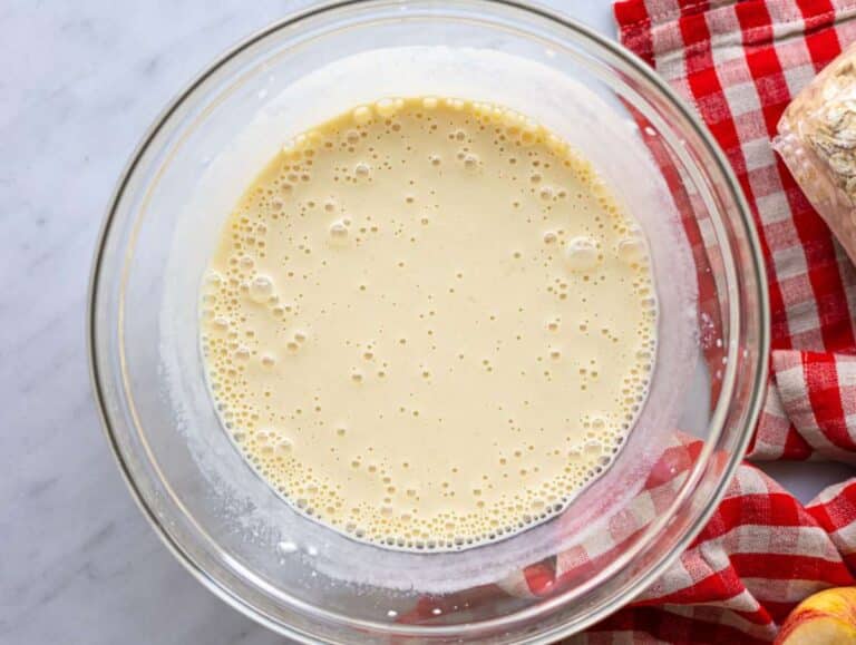 Step 2 Applesauce, yogurt, milk, honey, egg, and vanilla whisked in bowl.