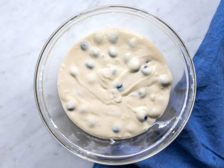 Step 2 Dry ingredients and blueberries folded into thick pancake batter.