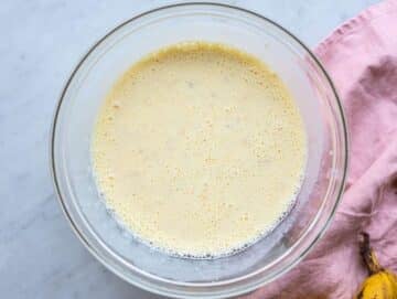 Step 2 Greek yogurt, milk, honey, vanilla, and egg whisked into banana mixture.