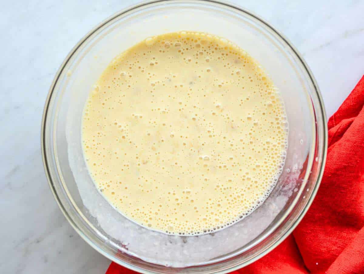 Step 2 Mashed bananas in bowl with yogurt, egg, honey, and milk.