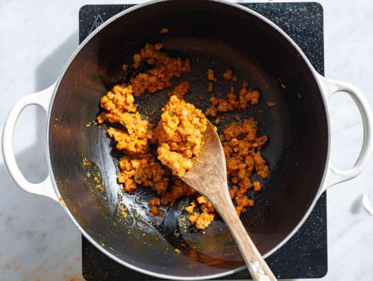 Step 2 Tomato paste garlic and spices stirred into softened vegetables.